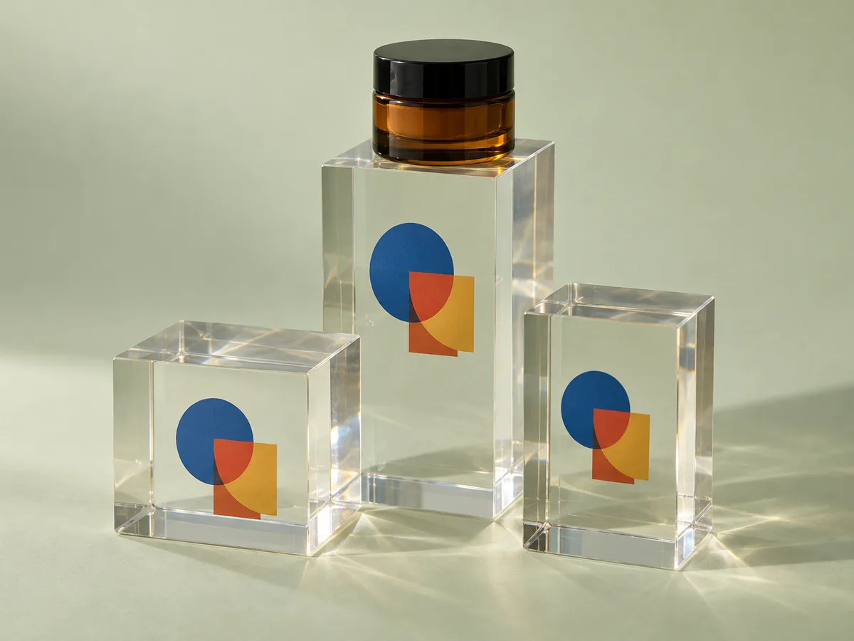 Clear acrylic blocks with a UV-printed logo used as booth giveaways