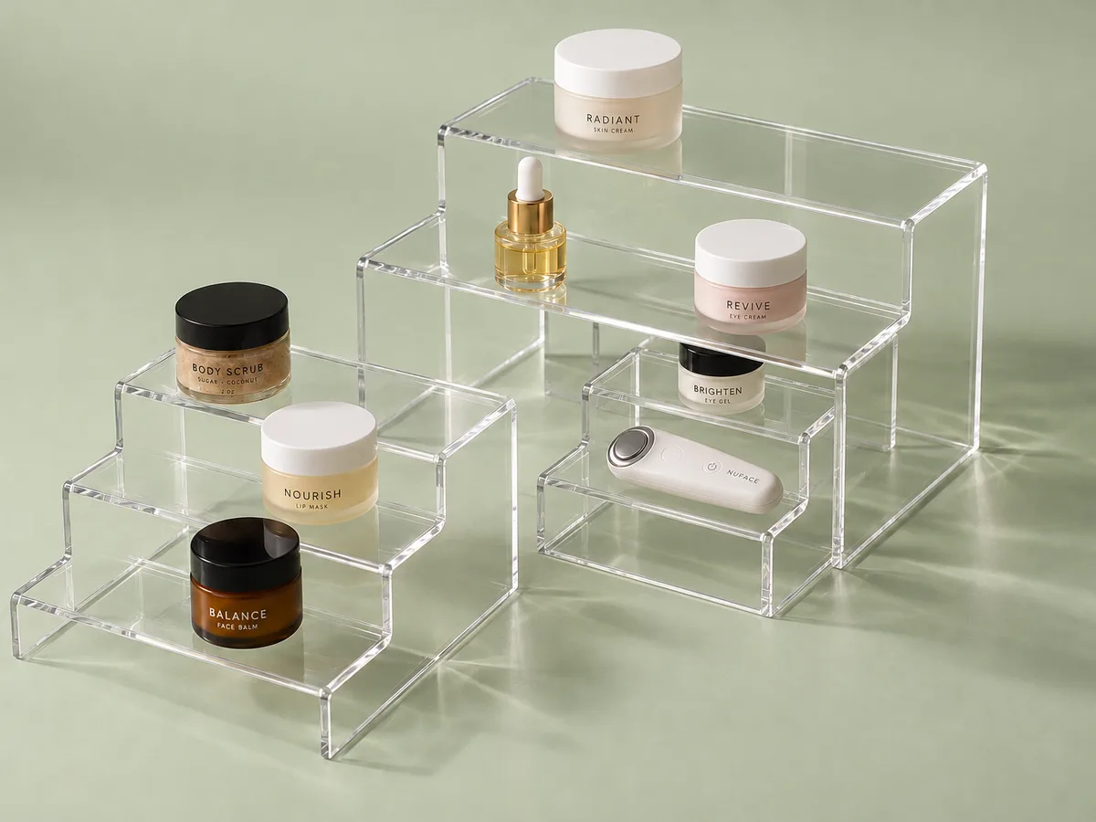 Nesting clear acrylic step risers with product samples
