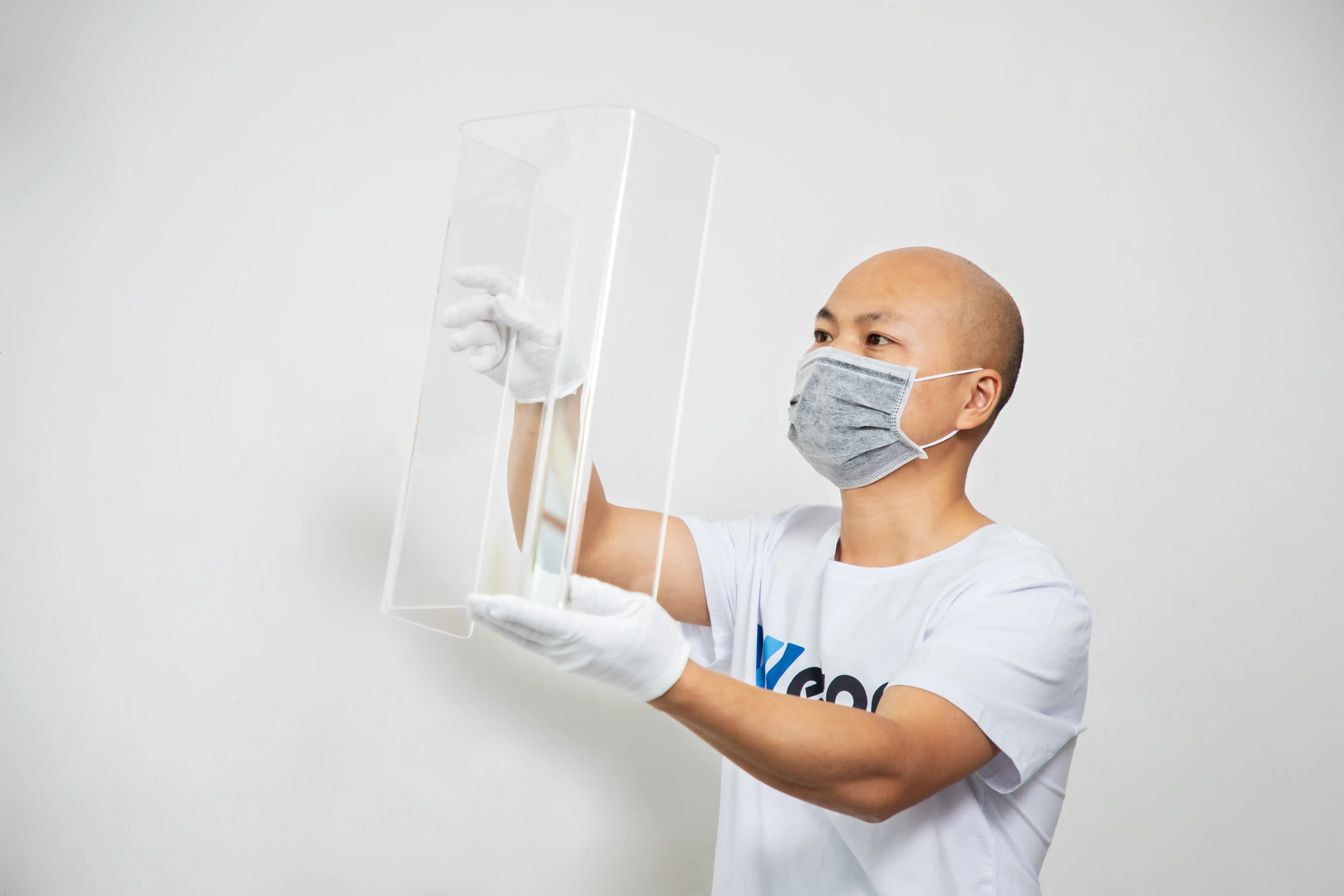 Wetop Acrylic quality control — inspector comparing finished acrylic product against approved sample