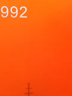 Photographed Xintao cast acrylic chip, code 992, translucent fluorescent orange