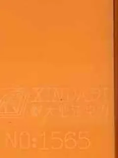 Photographed Xindadi cast acrylic chip, code 1565, opaque light orange