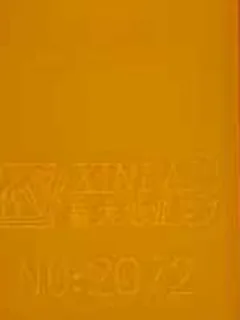 Photographed Xindadi cast acrylic chip, code 2072, opaque orange yellow