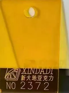 Photographed Xindadi cast acrylic chip, code 2372, translucent amber tint