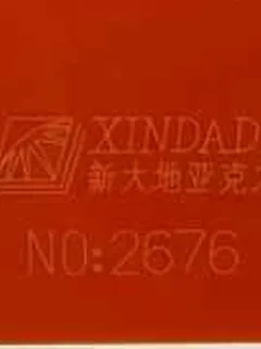 Photographed Xindadi cast acrylic chip, code 2676, opaque red orange