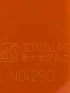 Photographed Xindadi cast acrylic chip, code 290, opaque tangerine