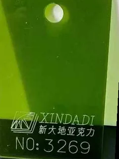 Photographed Xindadi cast acrylic chip, code 3269, translucent bottle green tint