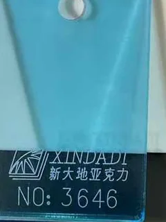 Photographed Xindadi cast acrylic chip, code 3646, translucent light teal tint