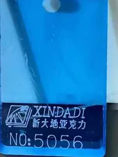 Photographed Xindadi cast acrylic chip, code 5056, translucent sky blue tint