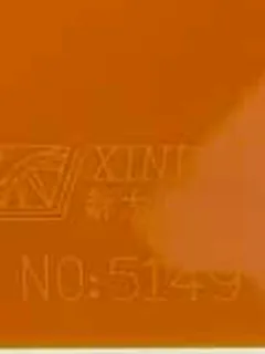 Photographed Xindadi cast acrylic chip, code 5149, opaque pumpkin orange