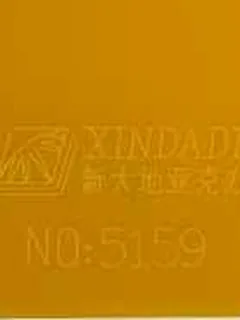 Photographed Xindadi cast acrylic chip, code 5159, opaque saffron yellow