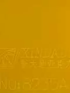 Photographed Xindadi cast acrylic chip, code 8235A, opaque amber yellow