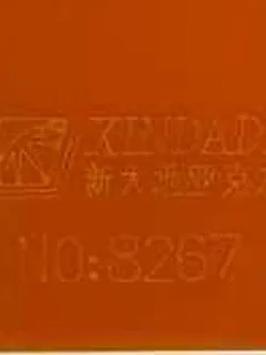Photographed Xindadi cast acrylic chip, code 8267, opaque deep orange