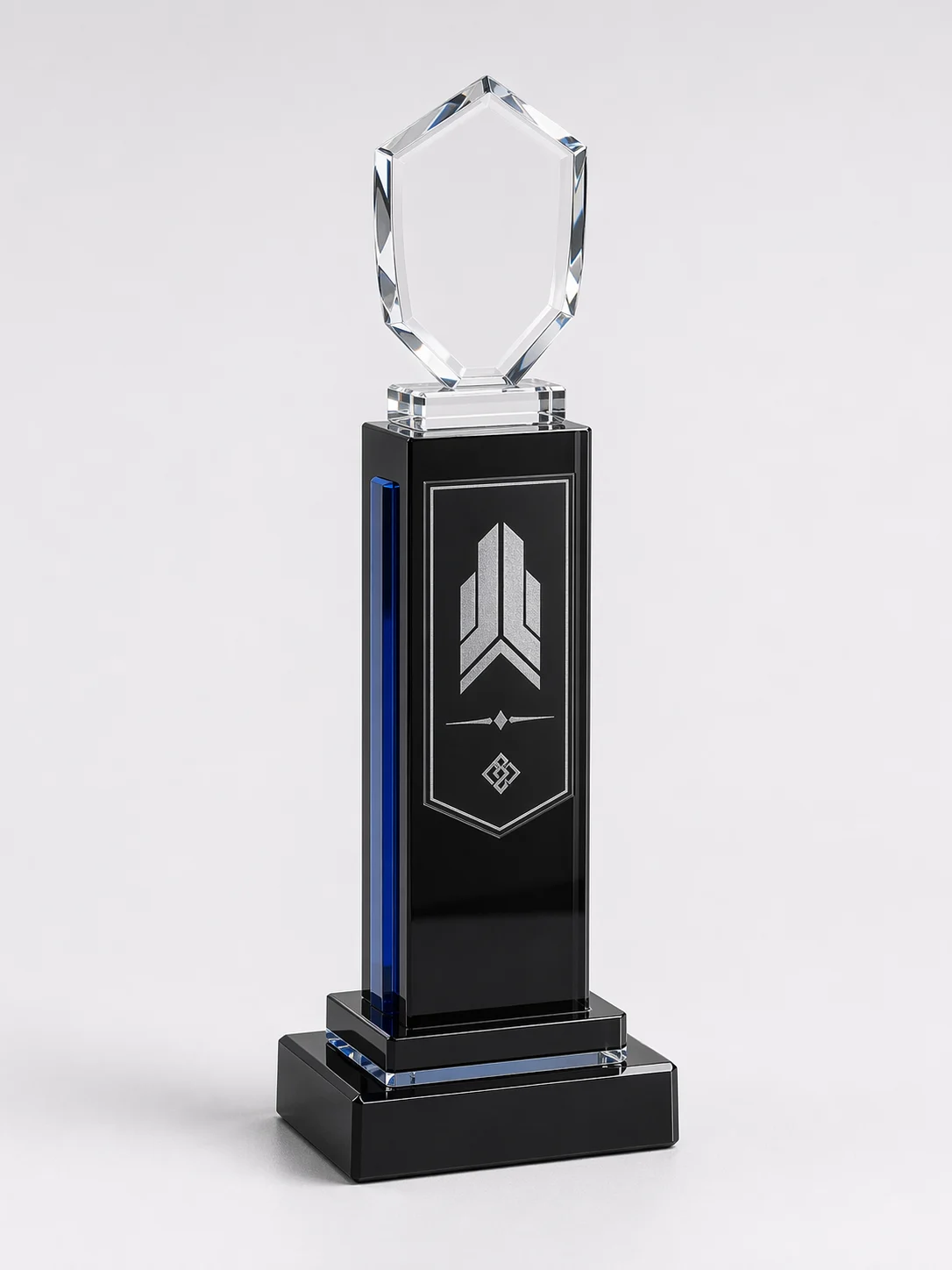 Acrylic column trophy with a glossy black pillar and a faceted clear shield top piece