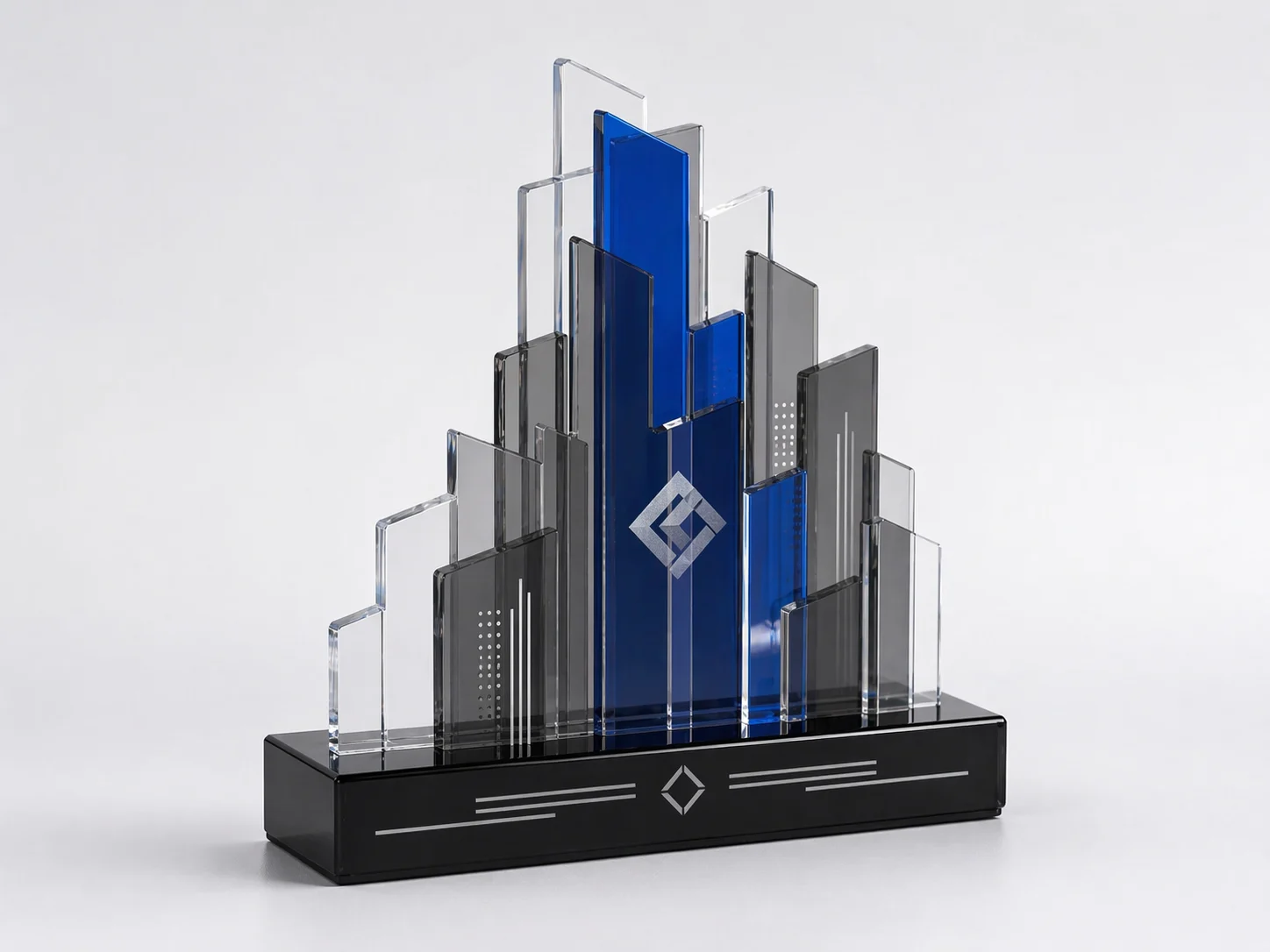 3D acrylic deal toy with a layered skyline silhouette, blue center panel, and black acrylic base