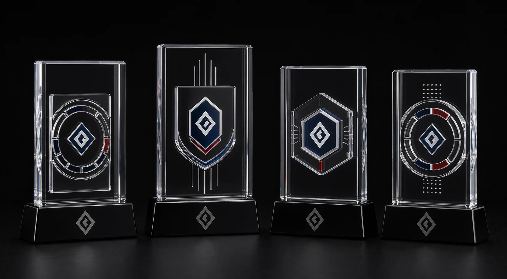 Lineup of clear acrylic embedment milestone trophies with distinct printed acrylic inserts on black bases