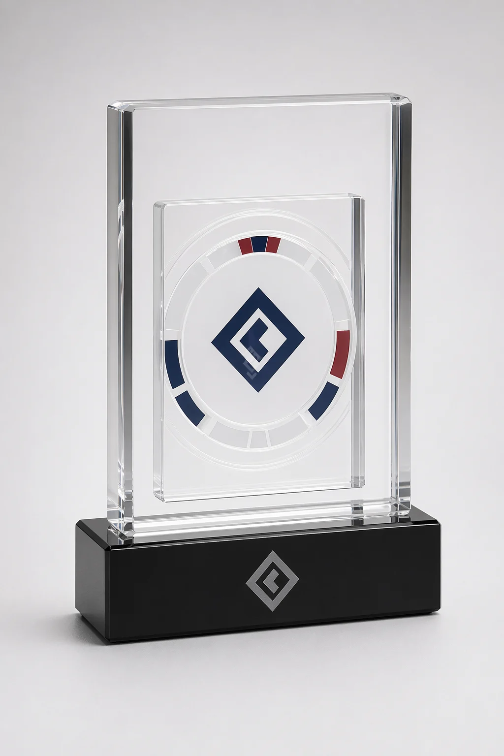 Clear acrylic embedment trophy with a printed acrylic insert suspended inside a polished block on a black acrylic base