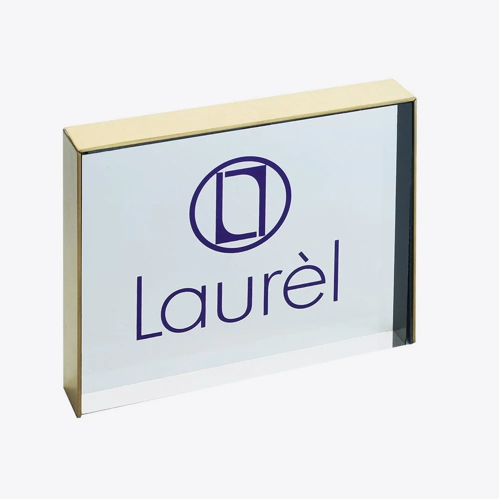 Silk-screen printed acrylic logo block with a purple logo on a clear polished block
