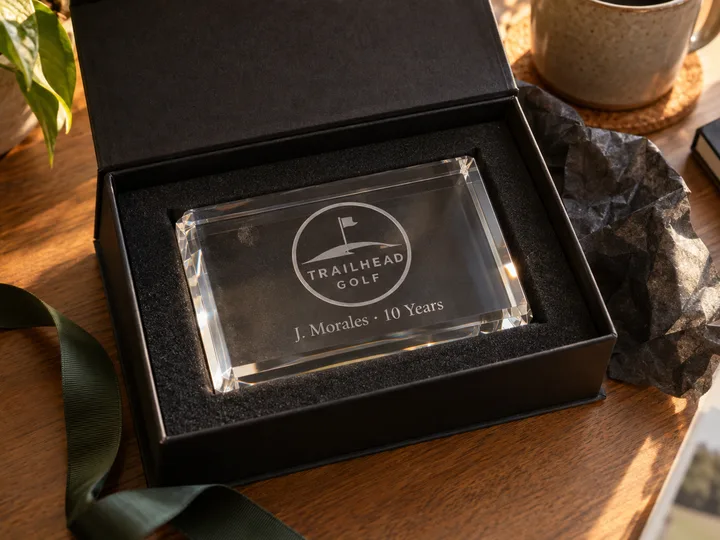 Laser-engraved TRAILHEAD GOLF acrylic logo block with a personal name line in an open black gift box