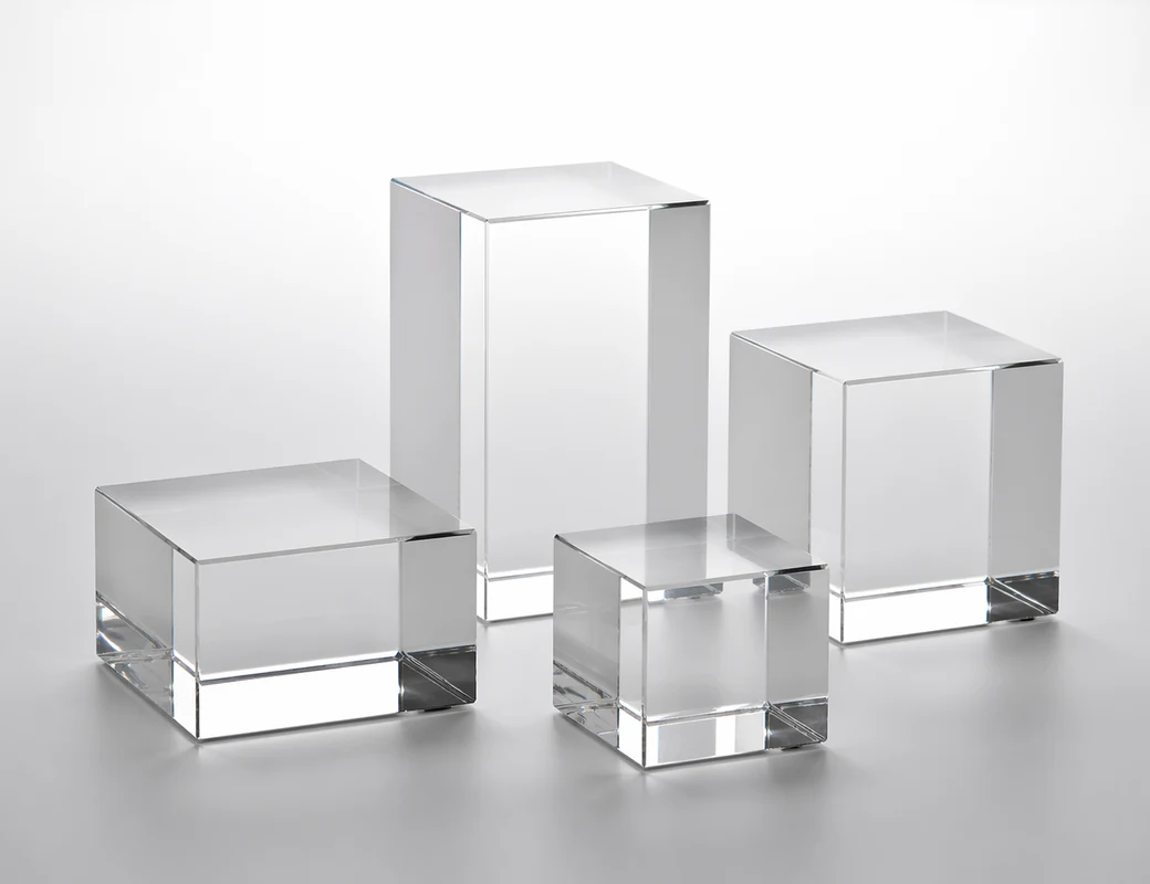 Crystal-clear acrylic display blocks used as product risers