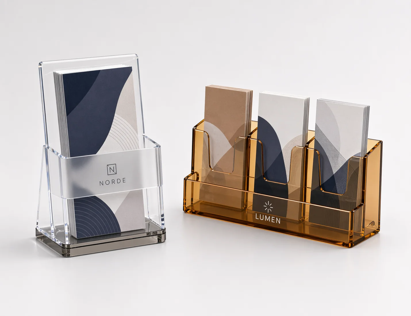 Countertop acrylic brochure holders with single-pocket clear and three-pocket amber configurations for branded desk displays