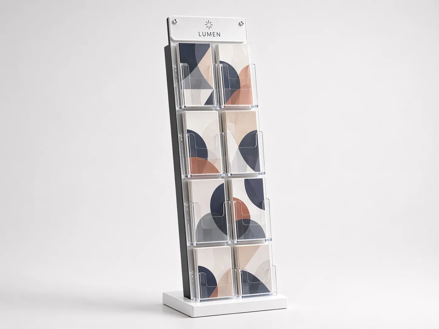Tiered floor-standing acrylic brochure holder with eight forward-facing brochure pockets on a weighted base