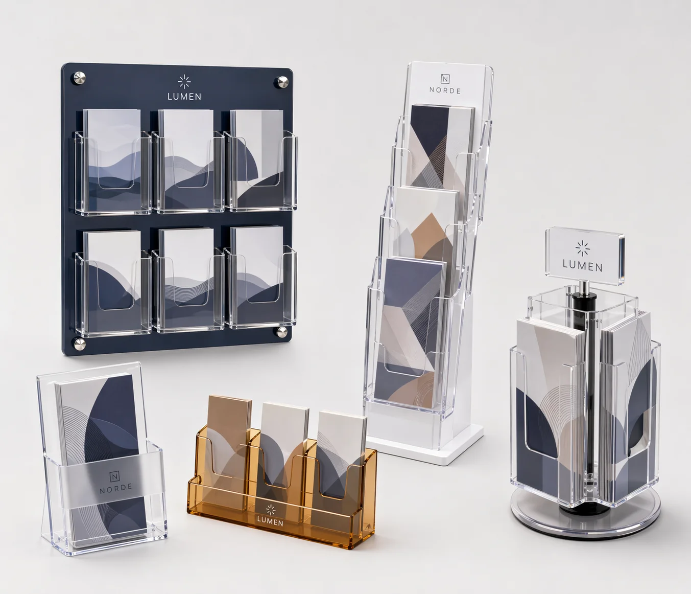 Collection of custom acrylic brochure holders with wall-mounted, countertop, floor-standing, and rotating configurations in clear, frosted, tinted, and branded acrylic