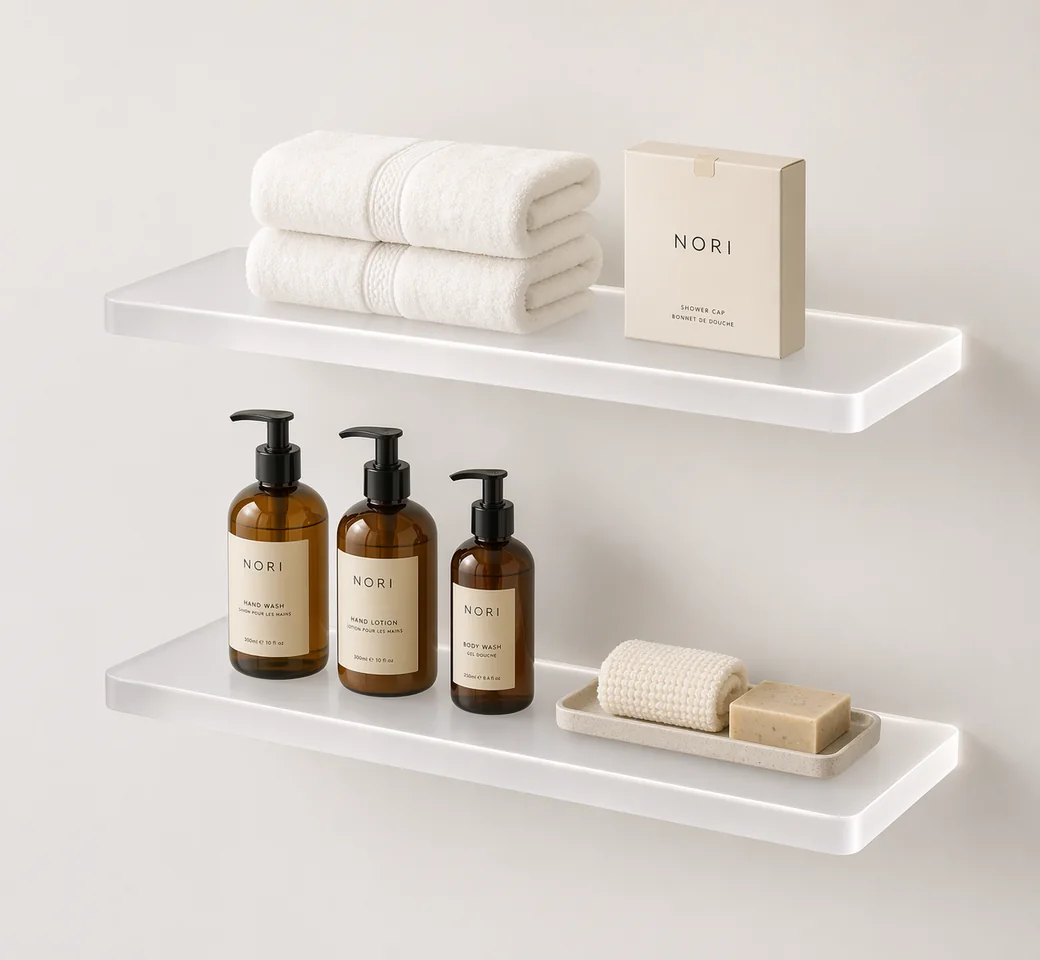 Frosted acrylic floating shelves with hidden hardware, hotel-style towels, and amenity bottles