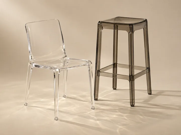 Clear cast acrylic dining chair with a curved seat and back
