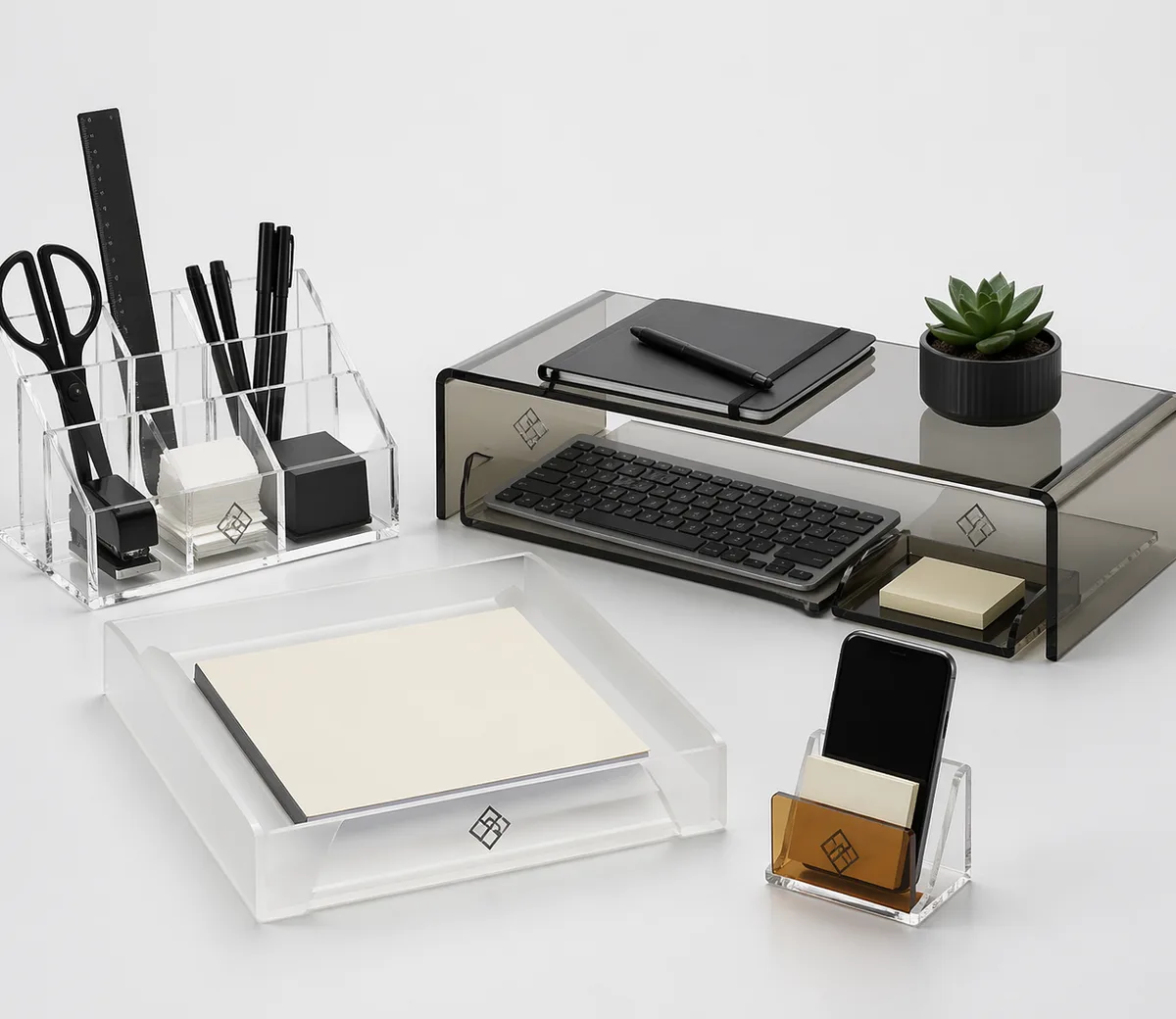 Custom acrylic desk organizer set with desk caddy, frosted letter tray, smoked monitor riser, and phone holder