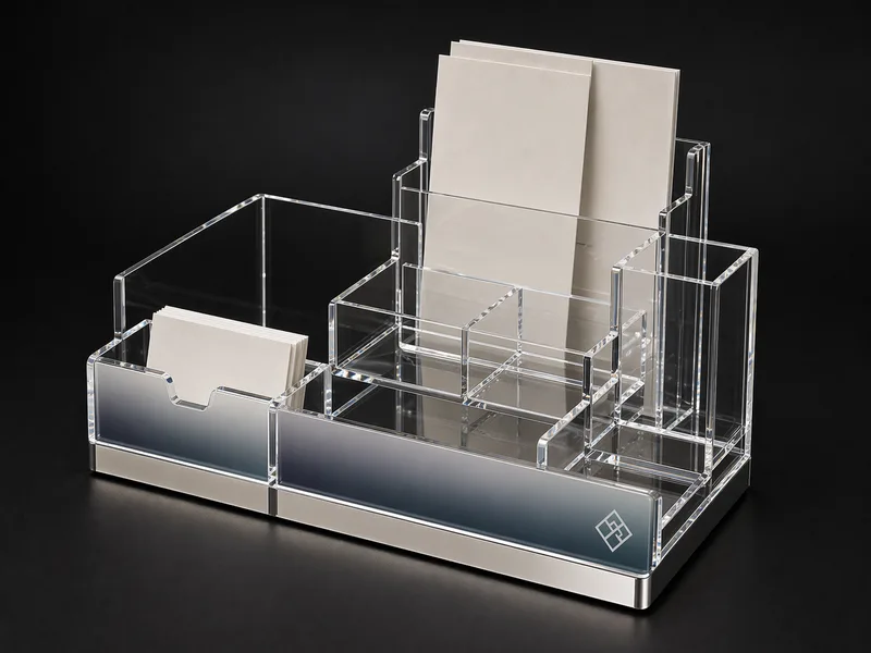 Custom acrylic reception desk station with brochure slot, mirrored base, and branded front panel