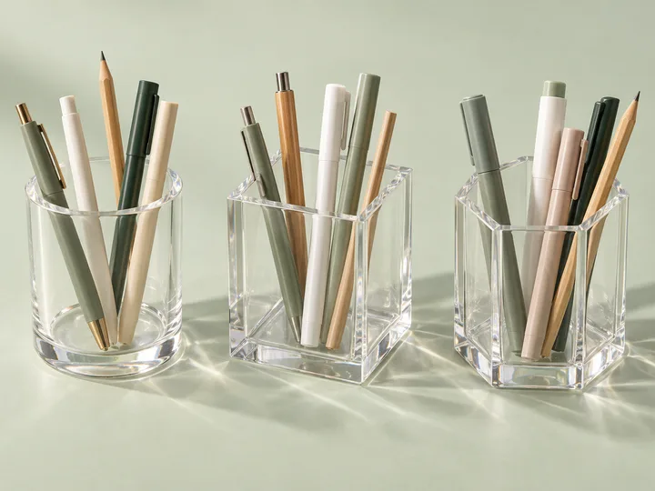 Round, square and hexagonal clear acrylic pen holders filled with pens and pencils