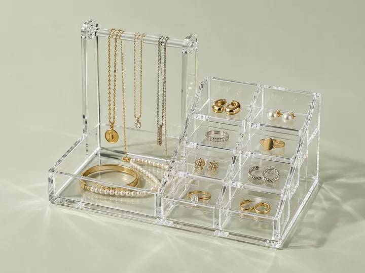 Acrylic jewelry organizer tray with velvet-lined ring and earring compartments