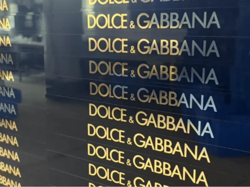 Gold foil logo detail on a custom acrylic tray