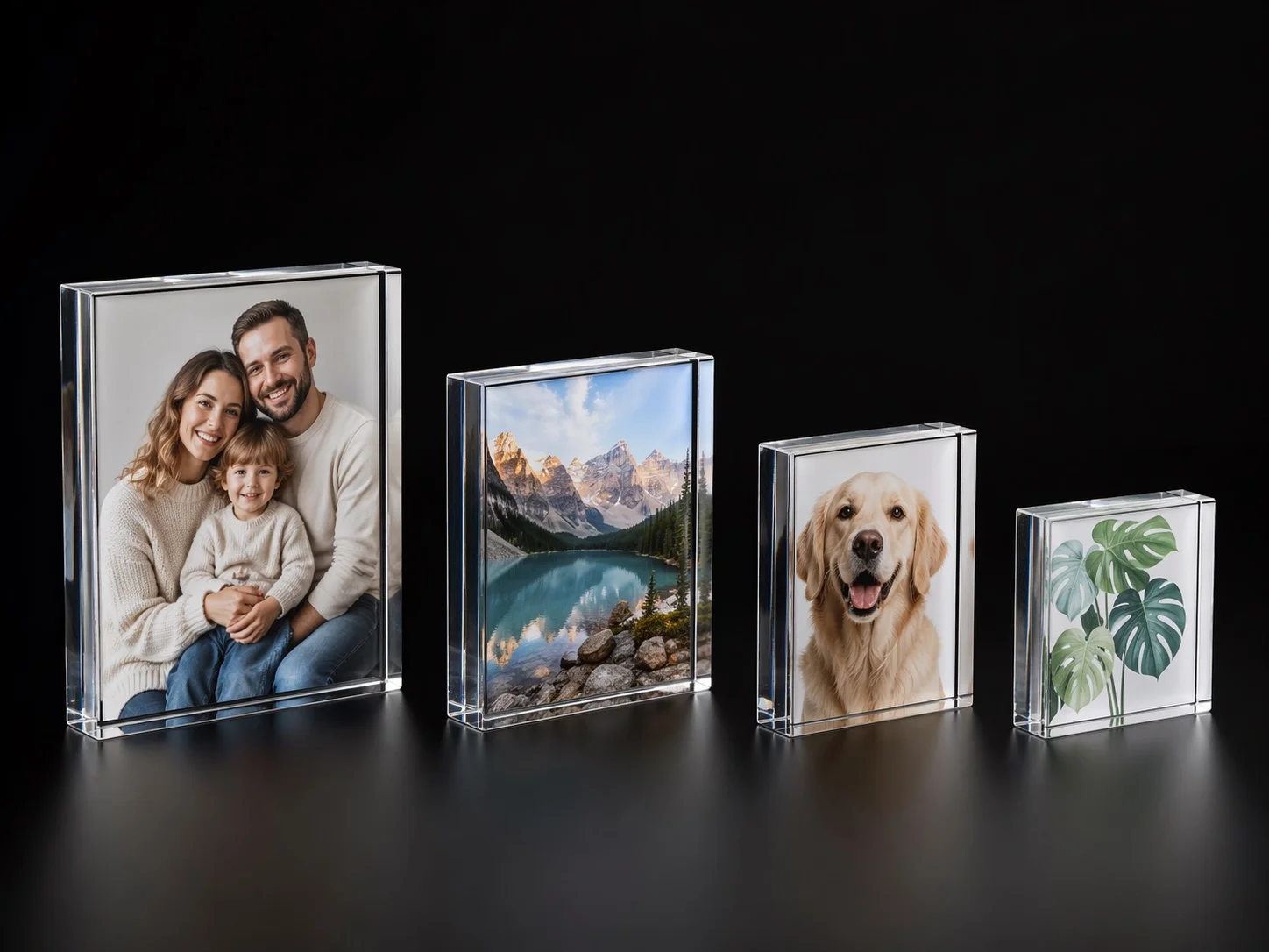 Four acrylic photo blocks in different sizes with family, landscape, pet, and botanical sample prints on a dark studio background