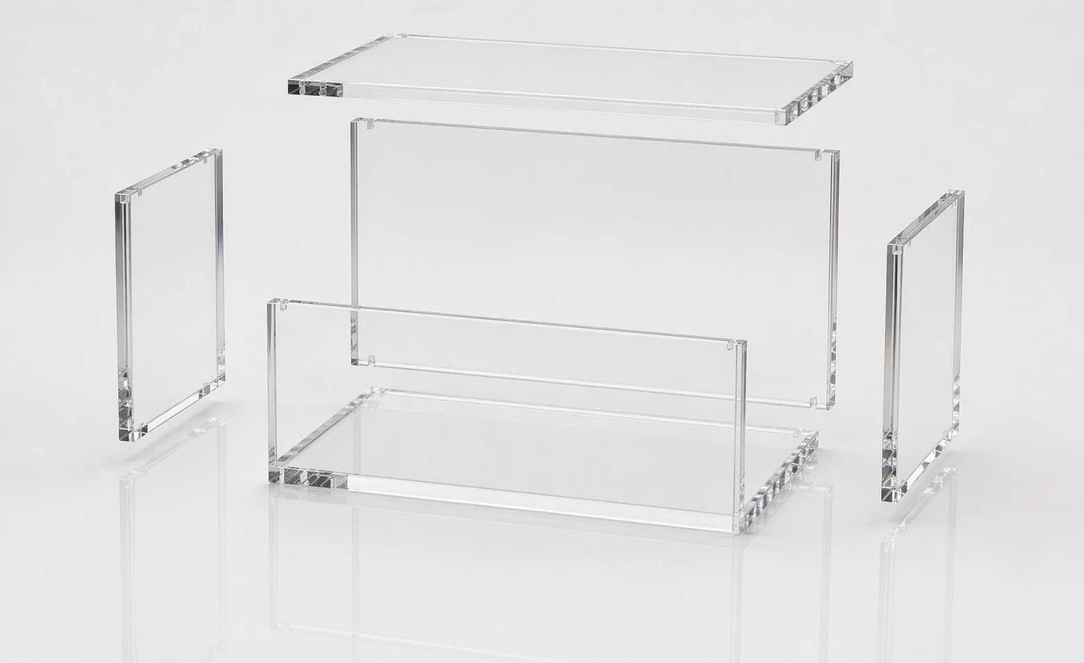 Photorealistic exploded assembly of an empty clear acrylic trading card display case with separate lid, front panel, side panels, back panel, and base