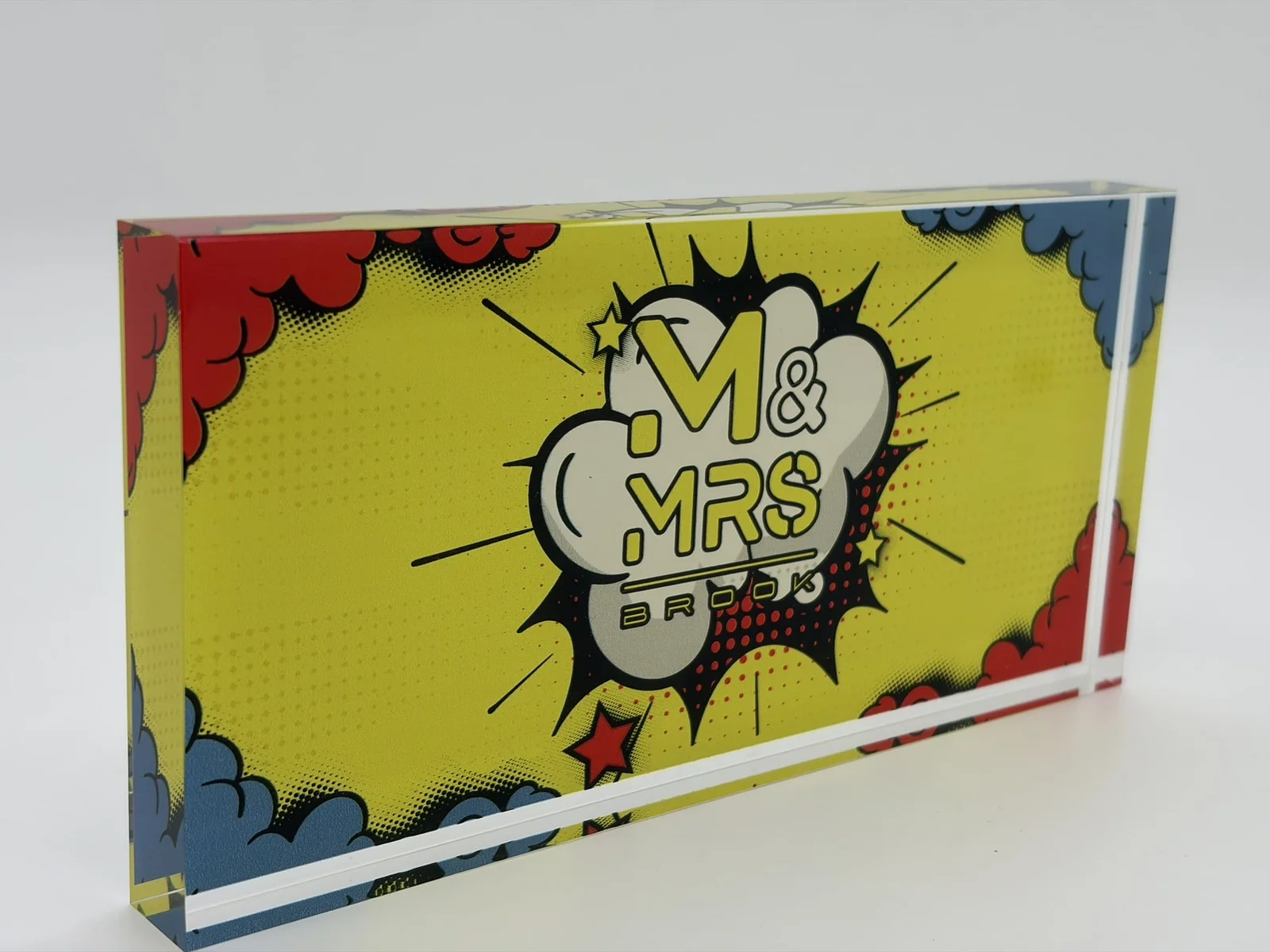 Full-color comic-style acrylic logo block with polished clear acrylic edges