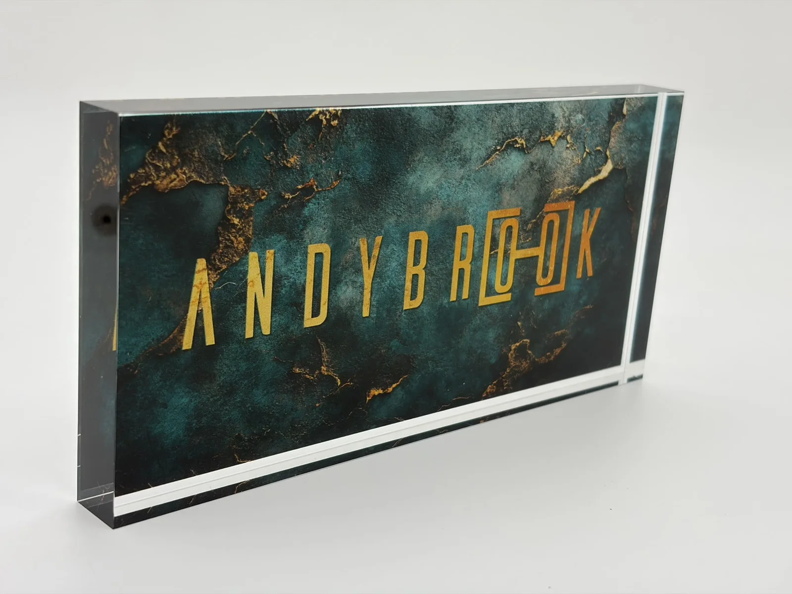 Embedded acrylic logo block with a full-color printed brand panel sealed behind clear polished acrylic